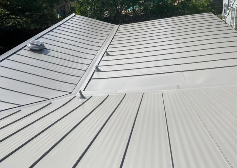 Solar attic fan installed on a metal roof for Roof Ventilation in Bermuda Dunes